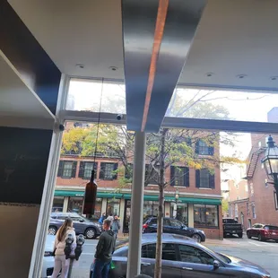 a view of a street through a window