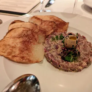 Beef Tenderloin Tartare. $18. Cornichon, capers, shallots, quail egg, potato crisp.