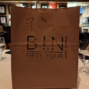 Bin 54 takeout/leftovers brown bag.