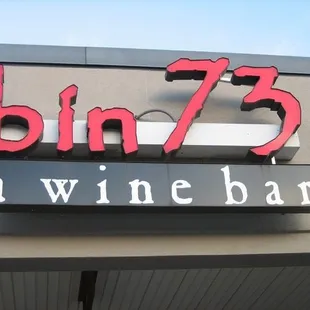 a sign for a wine bar