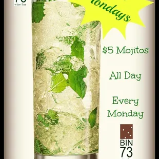 a glass of mojito with mint leaves