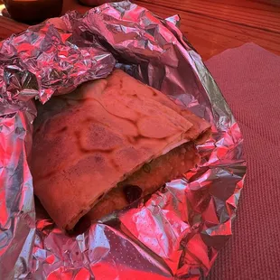 One half of the roasted duck jian bing! Split it with my partner, we both loved it.