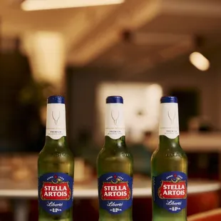 three bottles of beer on a table