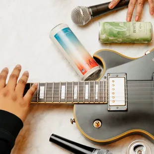 a person playing an electric guitar
