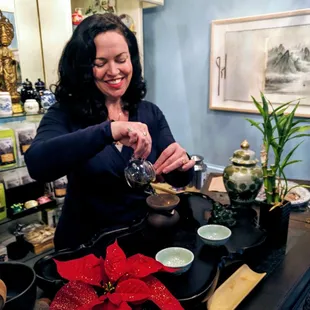 The playful tea hostess slinging tea!