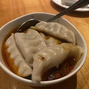 Dumplings in spicy chili sauce. I wish it were more filled with mixture of ingredients including more veggies.... The taste was OK.