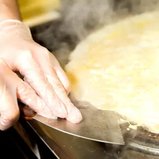 a person&apos;s hands in a kitchen