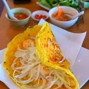 an omelet with shrimp and onions