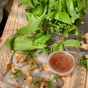 Our serving (w/ added arugula fr the garden - note that they&apos;re not vegetarian as the dipping sauce has fish sauce, the stuffing has pork...
