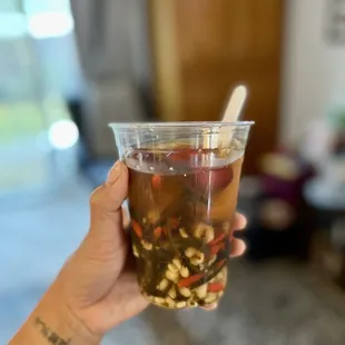 a person holding a cup of tea