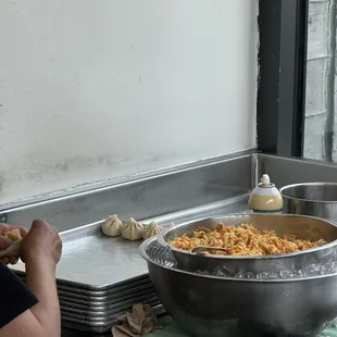 This place is fire! Come for their homemade momos all made by hand! Orange is this summer's color!