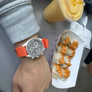 This place is fire! Come for their homemade momos all made by hand! Orange is this summer's color!