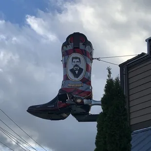 Boot sign with Dic Holiday's picture