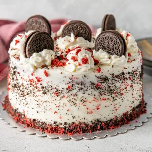 a cake decorated with oreo cookies and sprinkles