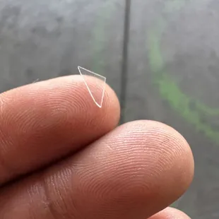 Piece of sharp defective lid of cup