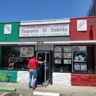 a man entering a restaurant