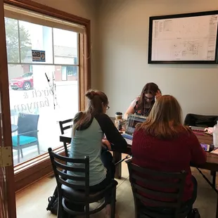 three women sitting at a table