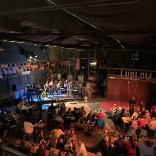a crowd of people sitting at tables