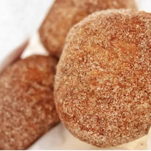 Dough-Doughs. Fried biscuit dough tossed in cinnamon and sugar.