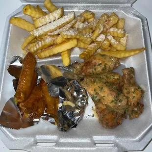 chicken wings, french fries, and baked potatoes