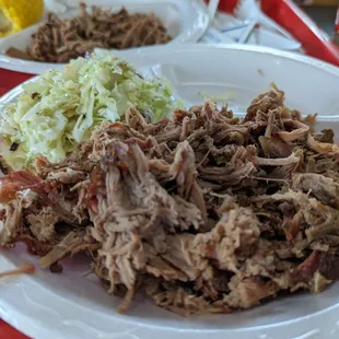 Brisket with a side of slaw.   The meat is shredded, unfortunately.  A real bummer.   But it does still taste good.
