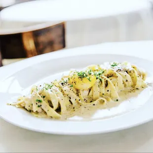a pasta dish on a white plate