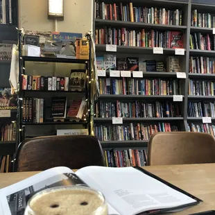 an open book on a table in a library
