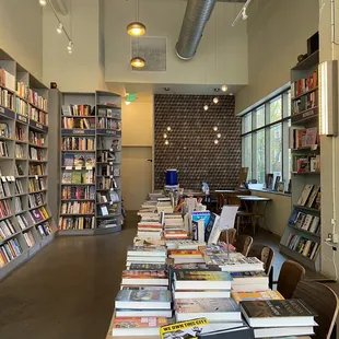 a long table full of books