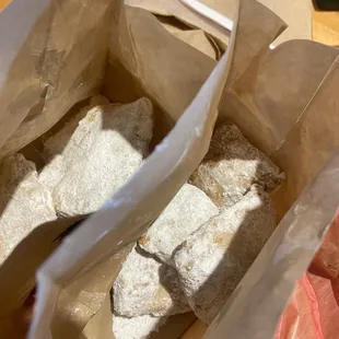 two pieces of bread in a paper bag