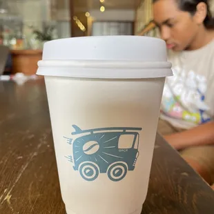 a coffee cup with a bird on it