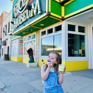 a little girl eating ice cream