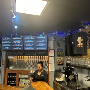 The menu board and the amazing Roz as well as some merch!