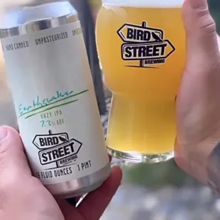 a hand holding a can of bird street brewing