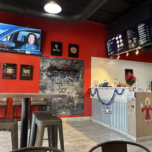 a bar with a television on the wall