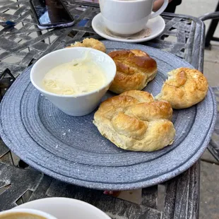 a plate of pastries and a bowl of soup