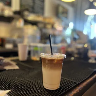 a cold beverage in a plastic cup