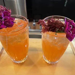 Orange rose sangria with edible flowers.