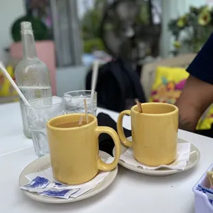 two cups of coffee on a table