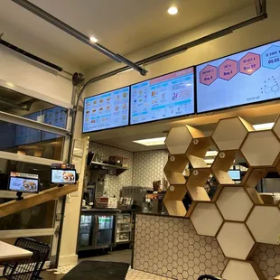 a restaurant with a large screen