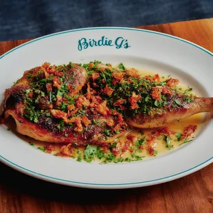 lemon pepper chicken with crispy lemons and fresh herbs