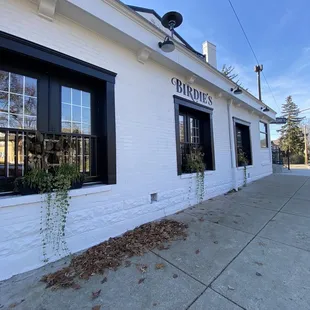 Outside the side of the building, entrance is on the corner facing the street