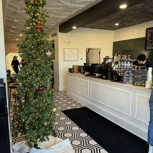 a christmas tree in a coffee shop