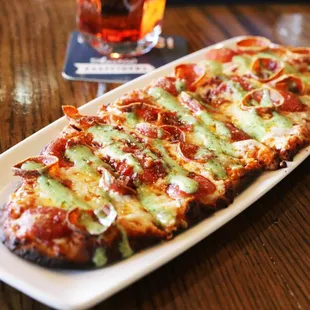 a slice of pizza on a plate