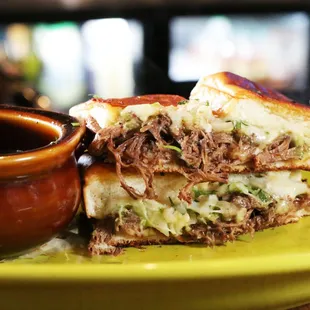 a sandwich and a cup of coffee