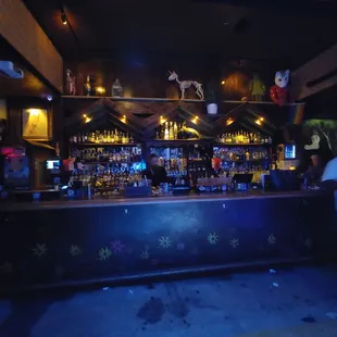 people standing in front of a bar