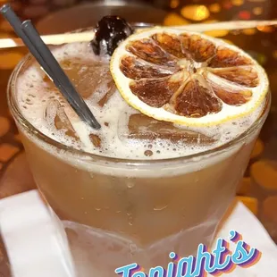 a drink in a glass with a spoon