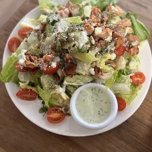 a plate of salad with dressing