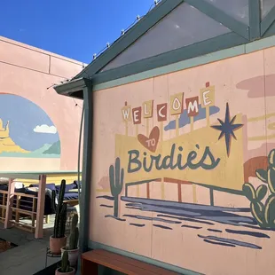 a colorful mural on the side of a building
