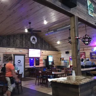 people sitting at tables in a restaurant