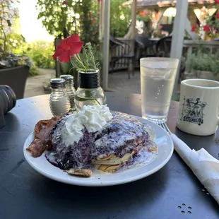 This delcious looking pile is a plate of blueberry lemon griddlecakes!